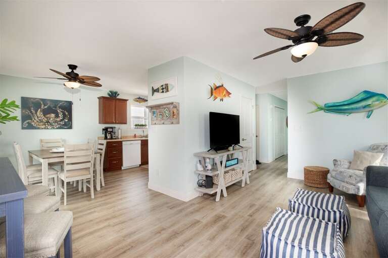 Our space harmoniously blends the living room, dining area, and kitchen.