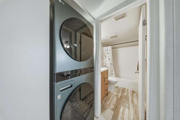 Centrally located laundry facilities offer easy access from the guest bedrooms and bathrooms throughout the condo.