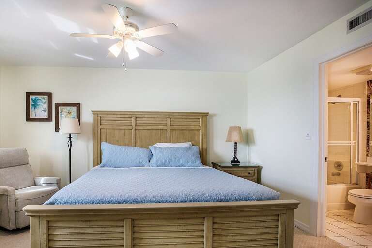 The master suite with a king bed and an en-suite full bathroom.