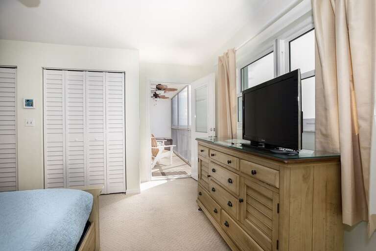 The master suite with a king bed and an en-suite full bathroom.