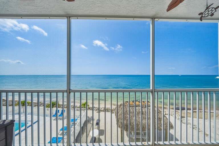 Unobstructed ocean views stretch to the horizon, providing a breathtaking backdrop for your waterfront Florida Keys getaway.