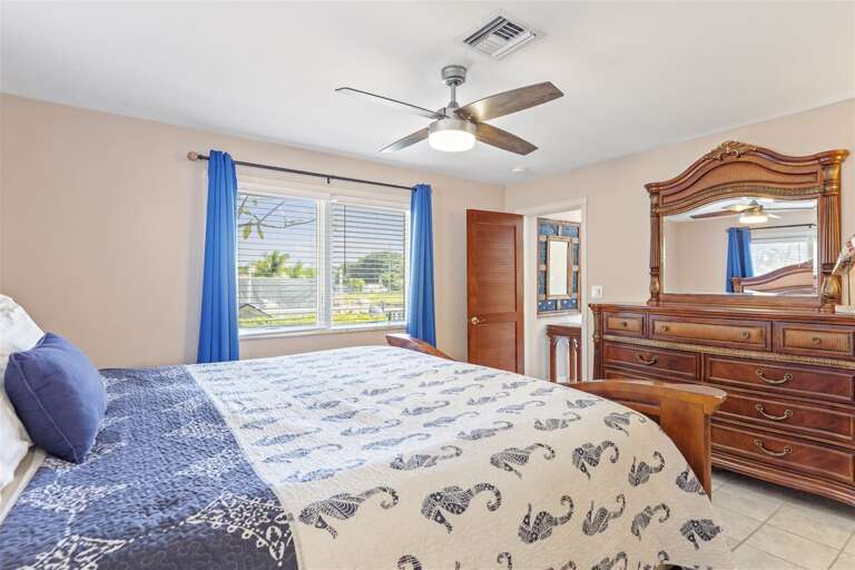 1st level bedroom 2 with a king bed.