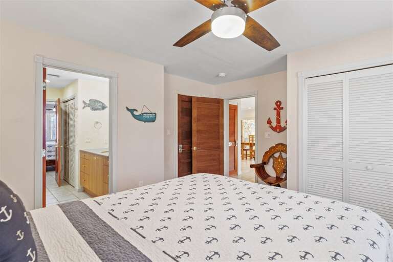 1st level bedroom 3 with a queen bed.