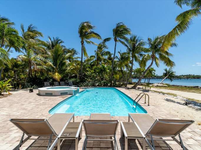 Plenty of pool side seating to relax and enjoy your private slice of paradise