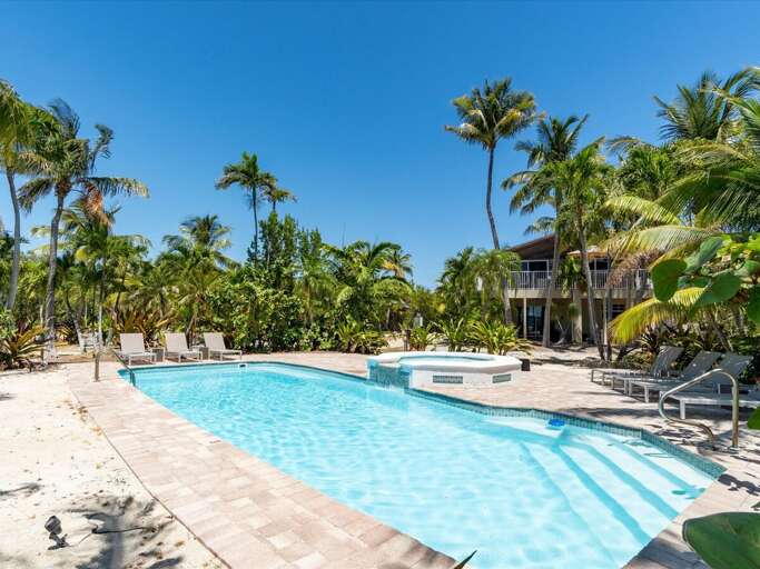 Relax in your own private paradise by the heated pool with spill over spa