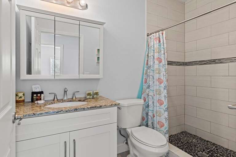 Hallway full bathroom with walk-in shower.