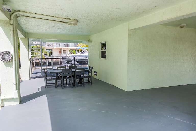 Outdoor dining area. Grill included with home but not pictured.