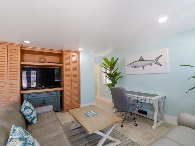 1st level bonus room/den with a convenient work station.