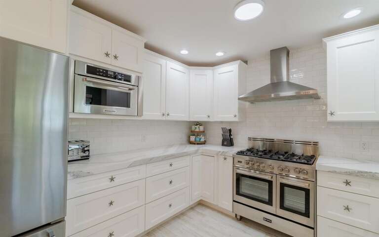 Where culinary dreams take flight: A fully-equipped kitchen, the heart of the home, ready to turn ingredients into memories. Where culinary dreams take flight: A fully-equipped kitchen, the heart of the home, ready to turn ingredients into memories.