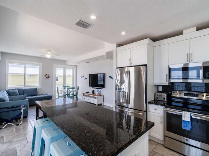 Experience the joy of cooking in this fully-equipped kitchen, featuring a spacious center island and scenic canal vistas. Experience the joy of cooking in this fully-equipped kitchen, featuring a spacious center island and scenic canal vistas.