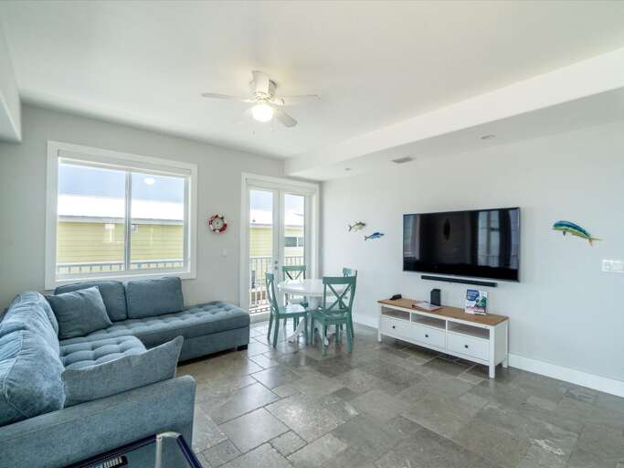 The living area accompanied by captivating canal views and entertainment from the TV. The living area accompanied by captivating canal views and entertainment from the TV.