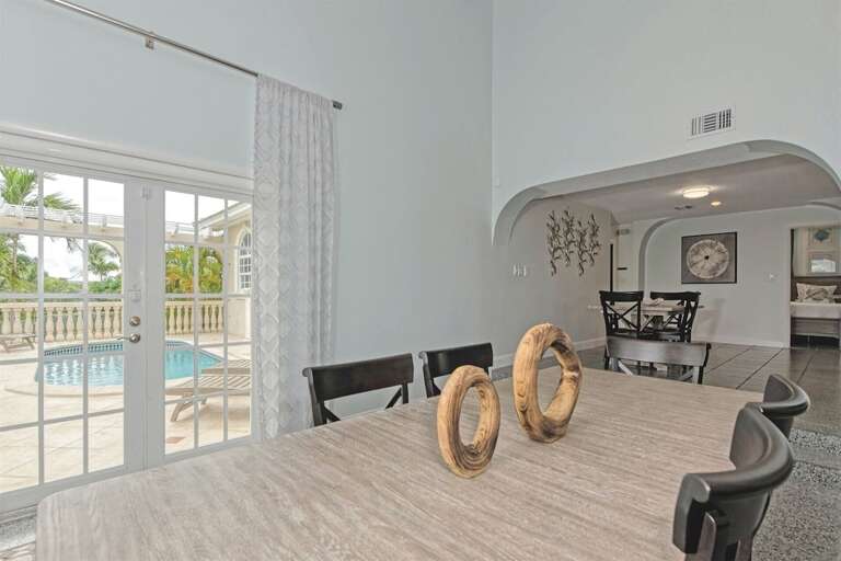 Entertainment meets elegance in this expansive area featuring a 6-seater dining space, a cozy living room, and an additional 4-seater table perfect for games or intimate dining.