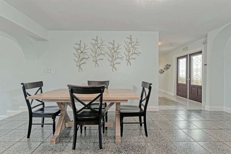 Entertainment meets elegance in this expansive area featuring a 6-seater dining space, a cozy living room, and an additional 4-seater table perfect for games or intimate dining. Entertainment meets elegance in this expansive area featuring a 6-seater dining space, a cozy living room, and an additional 4-seater table perfect for games or intimate dining.