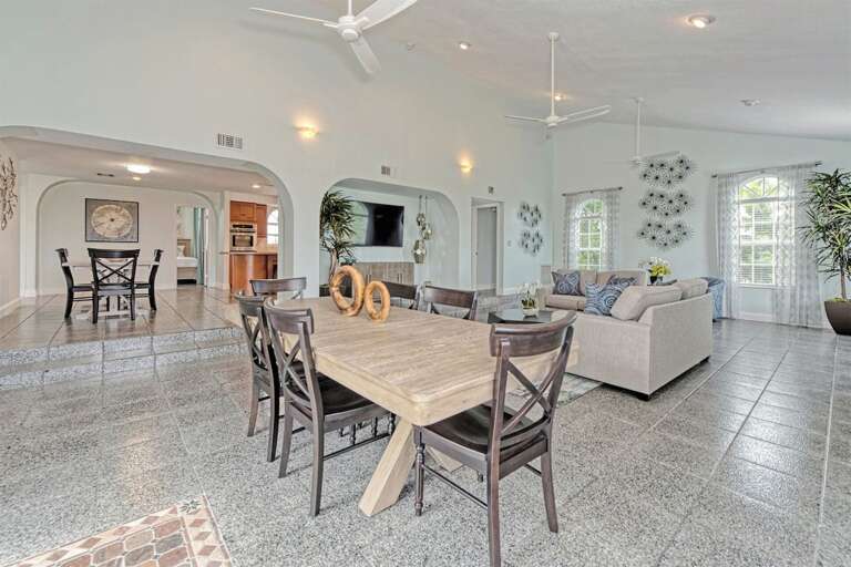 Experience the epitome of open-concept living with two dining spaces seamlessly integrated into a spacious living area. Experience the epitome of open-concept living with two dining spaces seamlessly integrated into a spacious living area.