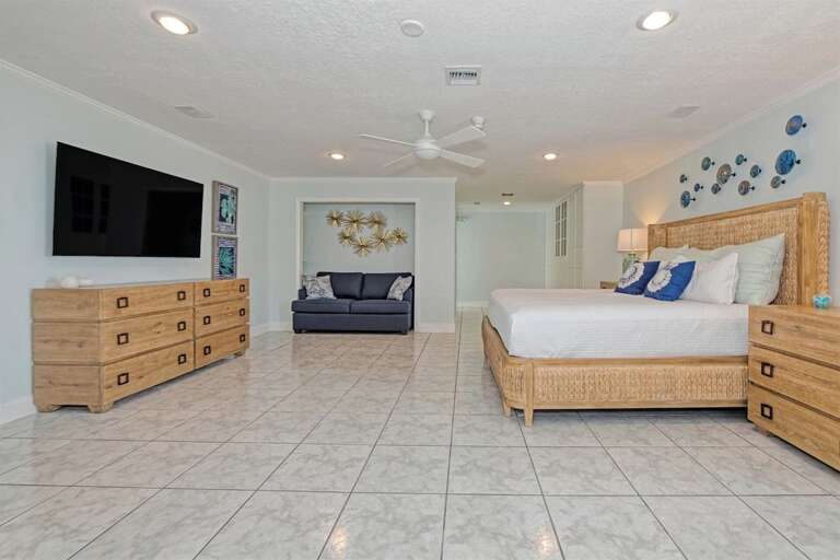 Indulge in luxury and comfort in our spacious 2nd level Master Bedroom, featuring a plush King bed, ensuite bathroom, and a TV for your entertainment needs.