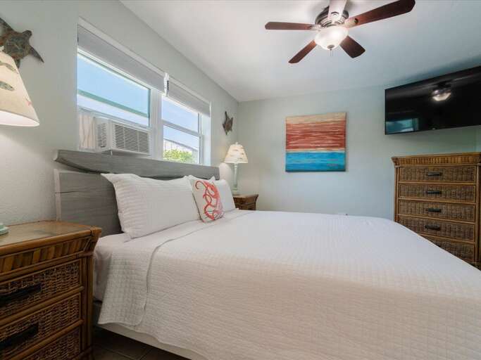 The master suite with a king bed and ensuite bathroom.