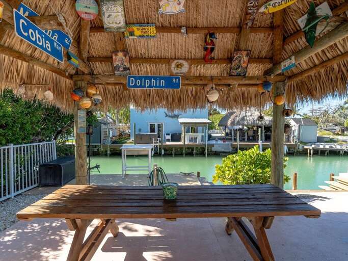 Tiki with picnic table seating.