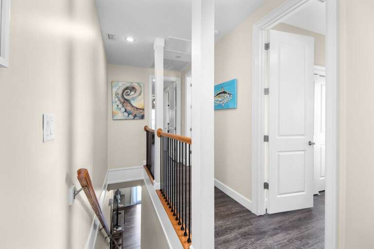 A bright interior stairway connects the living and sleeping spaces of this spacious multi-level Marathon vacation rental.