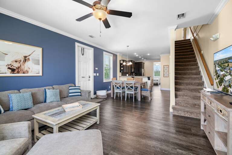 The open floor plan connects the living room, dining area, and kitchen for effortless group gatherings in Marathon.