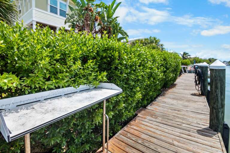 Prepare the day's catch at a convenient waterfront fish-cleaning station beside the home's private canal dock.