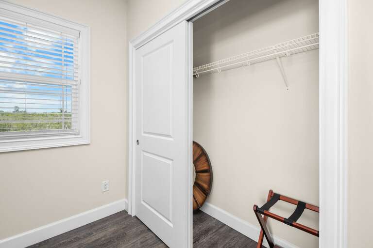 A spacious closet provides convenient storage for clothing, luggage, and beach gear during your Marathon vacation.