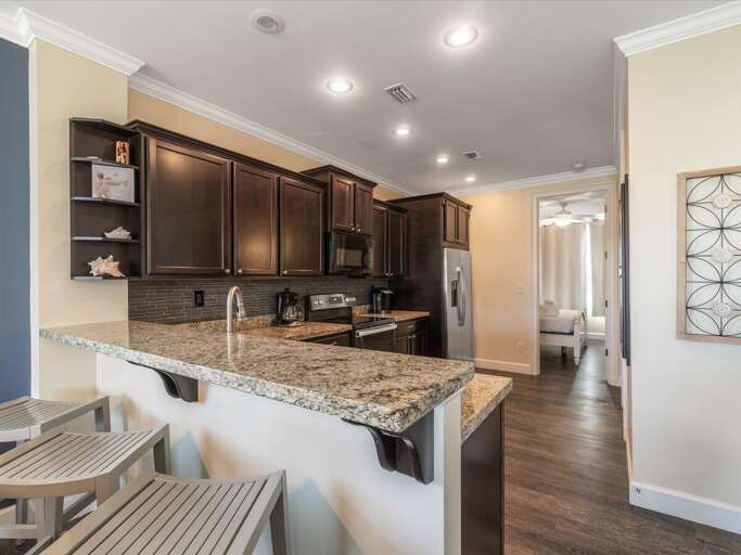 Cook in style with this sleek, modern kitchen featuring top-of-the-line stainless steel appliances. Cook in style with this sleek, modern kitchen featuring top-of-the-line stainless steel appliances.