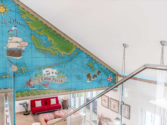 Hand painted mural, adventure awaits at Casa Feliz