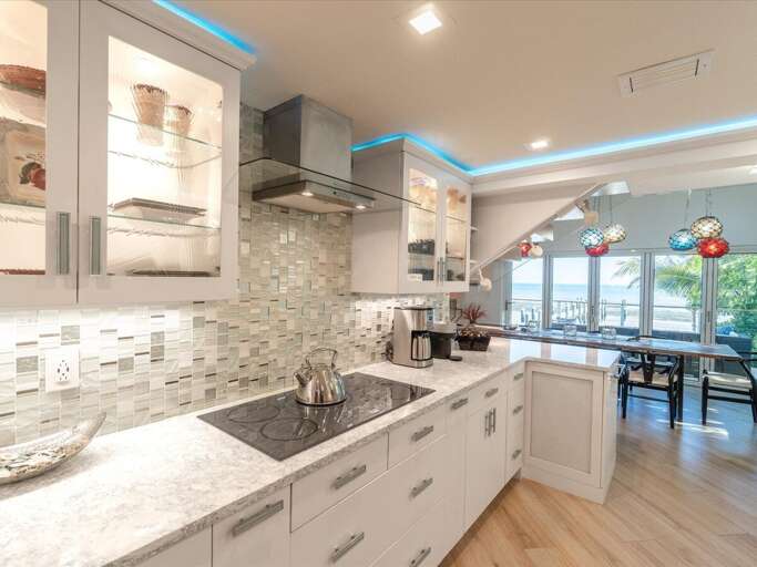 Where style meets functionality this kitchen shines with vibrant, beautiful tiles that bring warmth and character to every meal.