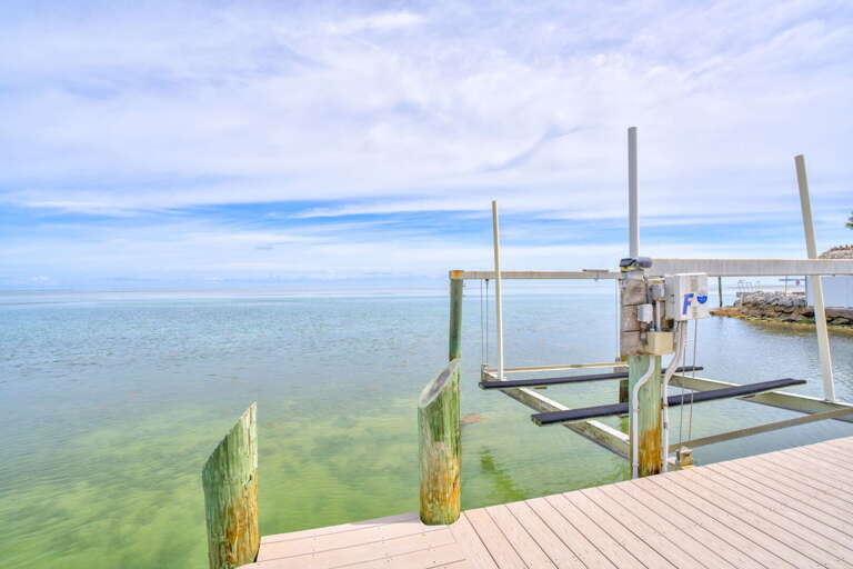 Enjoy direct ocean access with this private dock, perfect for boating, fishing, or simply relaxing while taking in stunning water views in Marathon, Florida Keys.