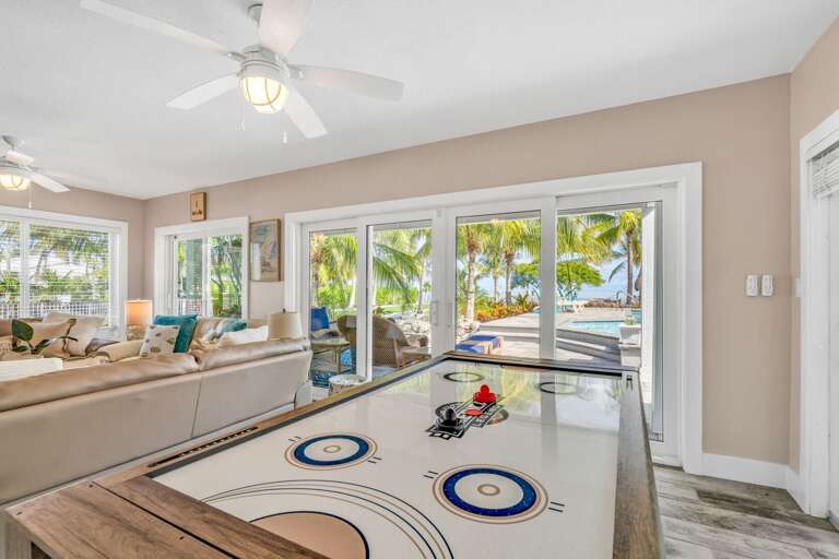 Enjoy hours of fun with this versatile 3-in-1 game table featuring ping pong, air hockey, and pool. Perfect for family game nights or friendly competitions during your Florida Keys vacation.
