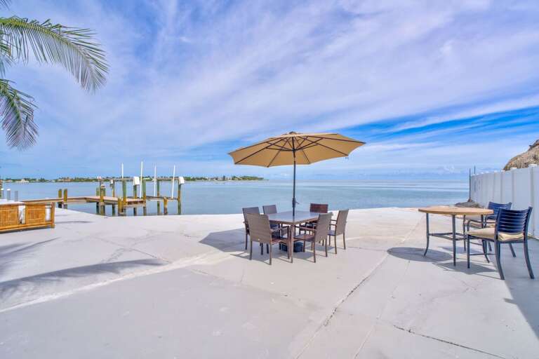 Enjoy stunning water views of the Atlantic Ocean from the spacious decks and living areas of this upscale Marathon vacation home, perfect for relaxing and entertaining.