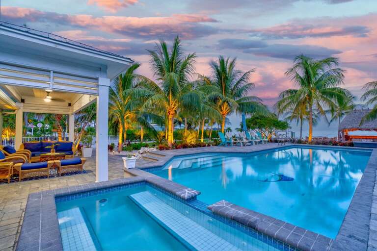 Enjoy the ultimate outdoor living with a private pool and expansive patio area designed for