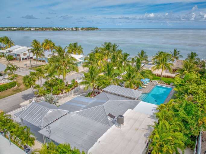 Enjoy your vacation with your pets in this oceanfront outdoor oasis, designed with secure, pet-friendly grounds and tropical greenery to ensure comfort and safety for all guests.