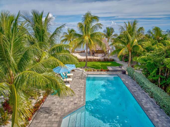 Enjoy year-round swimming in this oceanfront pool, just minutes from the best of Marathon. Whether you're floating under the sun or relaxing poolside, it's the perfect retreat for couples or families.
