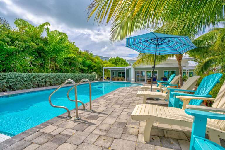Escape to a tropical oasis with a sparkling private pool overlooking the ocean. This Florida Keys vacation rental offers a peaceful, resort-like atmosphere with all the comforts of home.