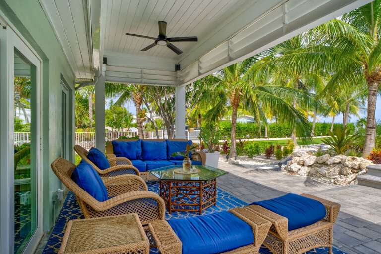 The expansive oceanfront patio is the perfect place to unwind, with comfortable outdoor seating, sea breezes, and panoramic coastal views just steps from your private rental in Marathon.