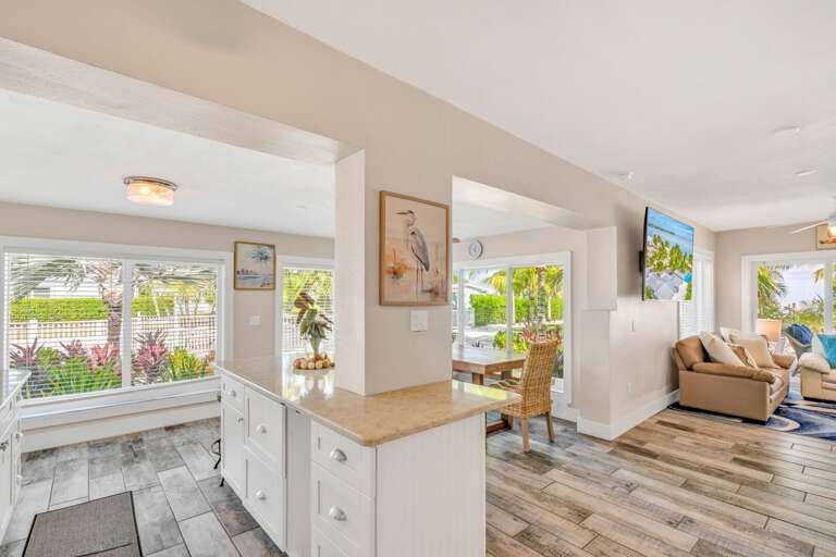 Host unforgettable dinners in this spacious dining room, where panoramic water views create the perfect backdrop for every meal in your private Florida Keys vacation home.