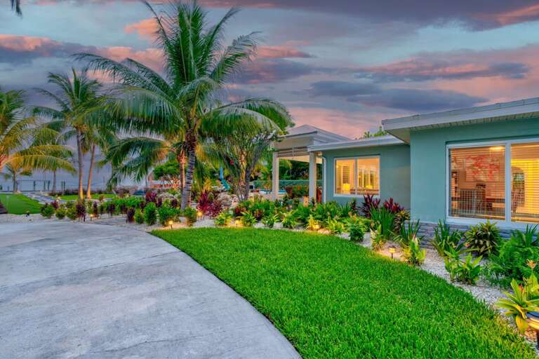 This luxury home in Marathon offers a rare private oceanfront yard with direct water views, ideal for family gatherings, lawn games, or just soaking up the Keys sun.