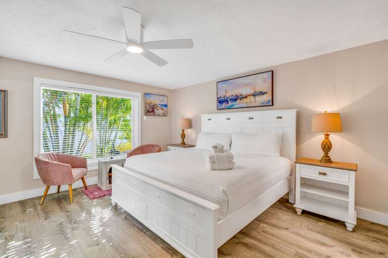 The master suite offers breathtaking ocean vistas and a modern ensuite bathroom, creating a serene retreat for guests seeking privacy and luxury in Marathon, FL.