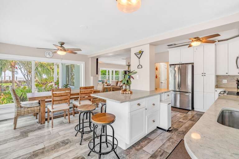 This stunning oceanview kitchen is fully equipped and features panoramic water views, perfect for guests who enjoy cooking while surrounded by coastal beauty.