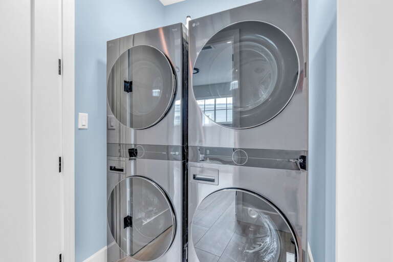 Convenient laundry space featuring two full sets of washers and dryers, perfect for extended stays and large groups in this luxury Florida Keys vacation home.