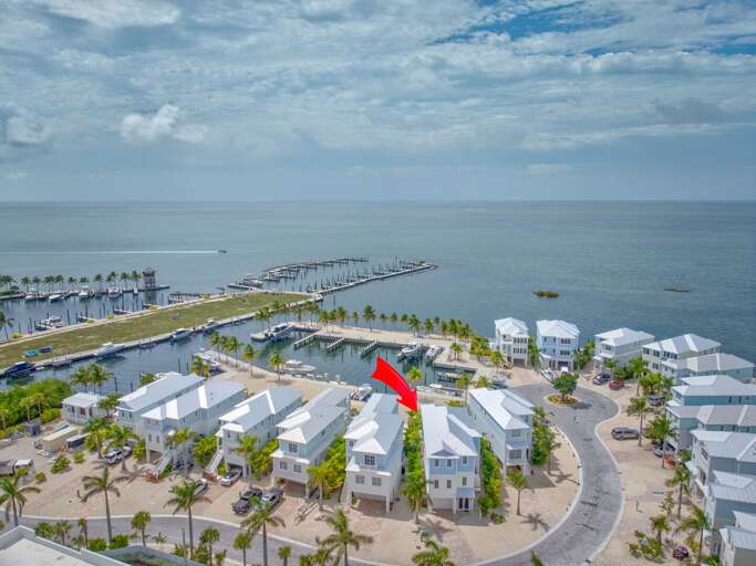 Drone capture of this upscale vacation home right on the Gulf in Marathon, with spacious outdoor living and deepwater dockage. Drone capture of this upscale vacation home right on the Gulf in Marathon, with spacious outdoor living and deepwater dockage.