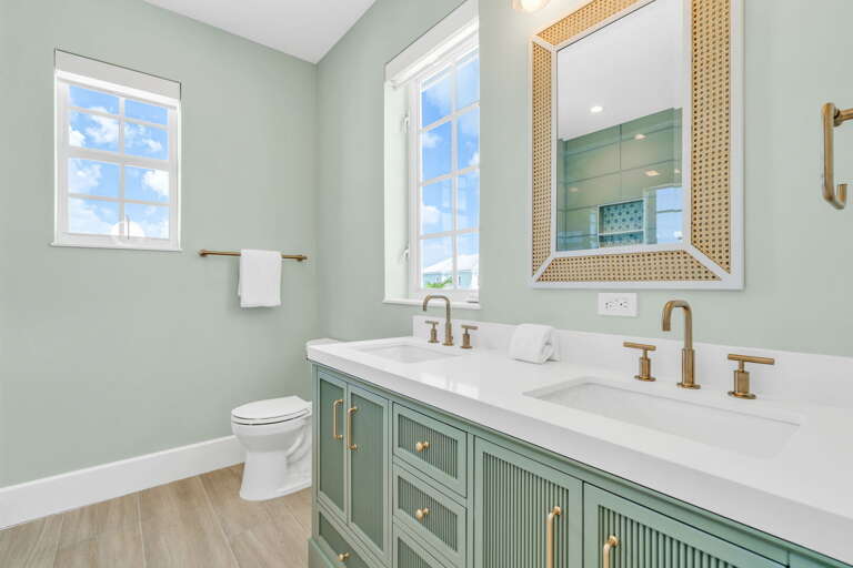 Experience comfort and style in this elegant third-floor ensuite bathroom, part of a spacious king bedroom in a luxury Marathon waterfront rental.