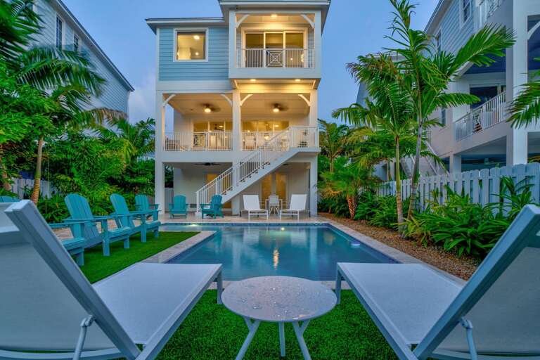 Experience upscale coastal living at this spacious 5-bedroom waterfront vacation rental with private dock and pool. Experience upscale coastal living at this spacious 5-bedroom waterfront vacation rental with private dock and pool.
