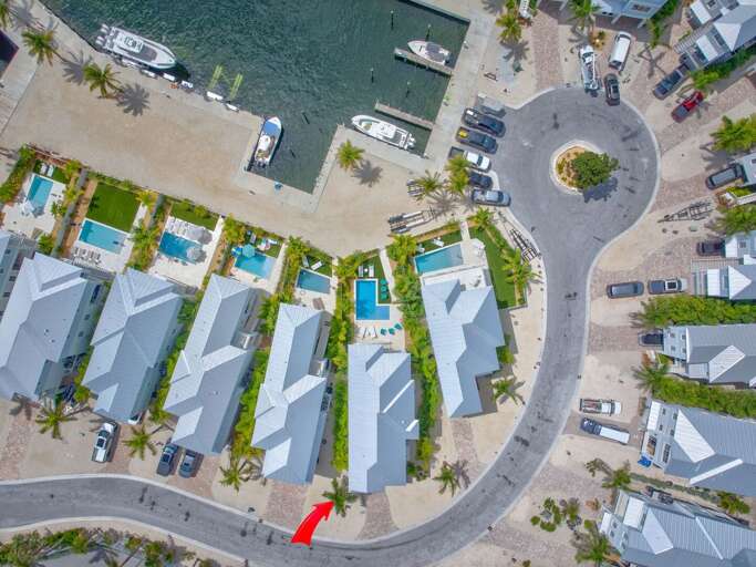 Gulfside vacation rental offering modern luxury, lush tropical landscaping, and plenty of outdoor space to relax and entertain.