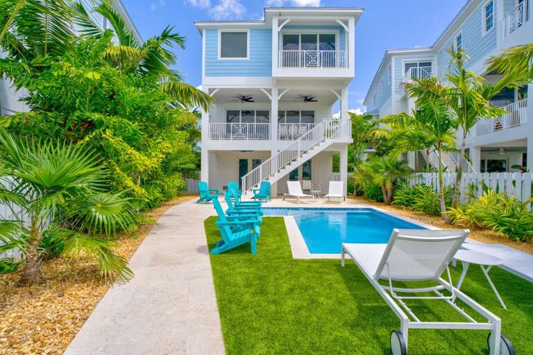 Soak up the sun poolside at this modern Marathon vacation rental with a private, Gulf-facing pool and spacious deck.
