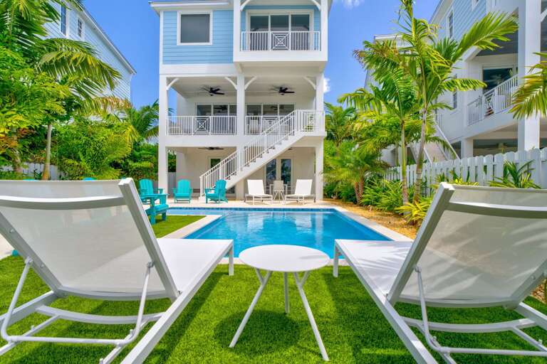 Stunning pool area overlooking the Gulf, perfect for family vacations and group getaways in the Florida Keys.