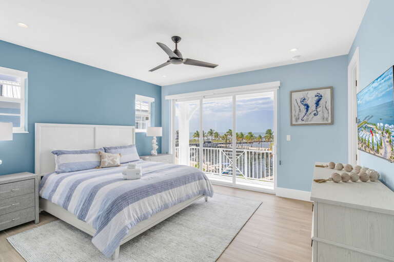Wake up to stunning Gulf views in this luxurious 3rd level master suite featuring a private balcony, spa-style ensuite bath, and walk-in closet in a top-rated Florida Keys vacation rental.