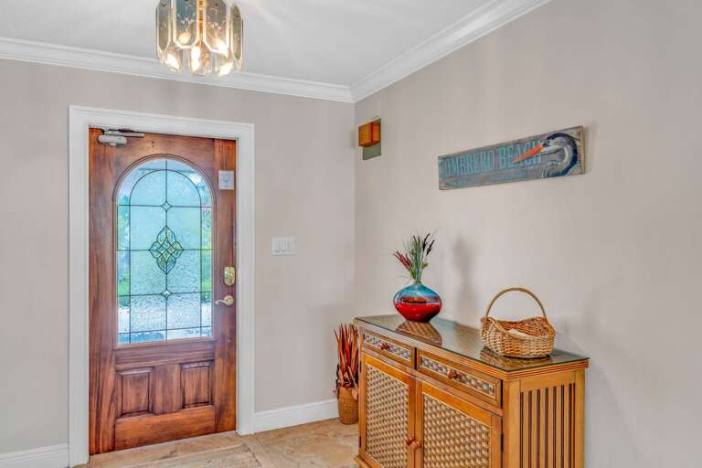 Bright and inviting entryway inside this Marathon vacation home with elegant finishes and waterfront views beyond. Bright and inviting entryway inside this Marathon vacation home with elegant finishes and waterfront views beyond.