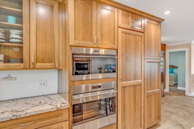 Chef's kitchen in a Marathon FL vacation rental featuring Wolf appliances, built-in microwave, and modern countertops. Chef's kitchen in a Marathon FL vacation rental featuring Wolf appliances, built-in microwave, and modern countertops.